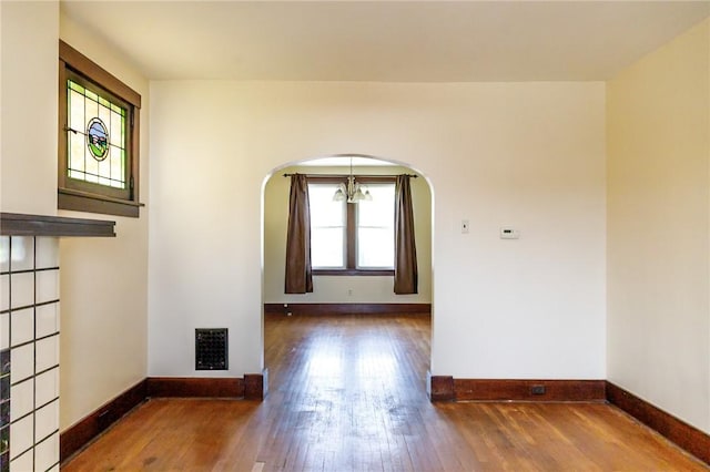 315 Wright St, Mckees Rocks, PA 15136 - empty room featuring wood finished floors, baseboards, and arched walkways