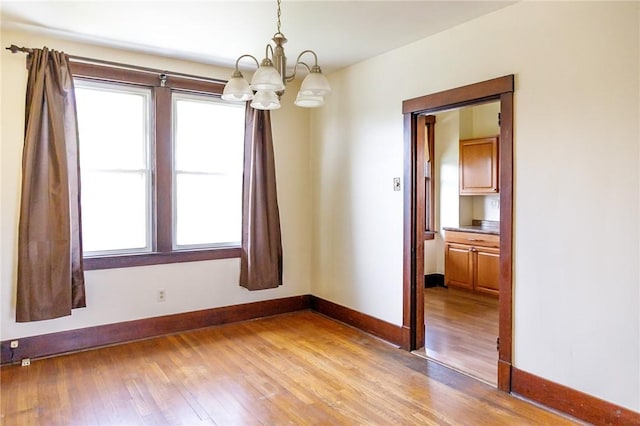 315 Wright St, Mckees Rocks, PA 15136 - spare room with a chandelier, light wood finished floors, baseboards, and plenty of natural light