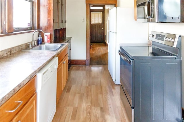 315 Wright St, Mckees Rocks, PA 15136 - kitchen featuring electric range, a sink, stainless steel microwave, dishwasher, and light wood-style flooring