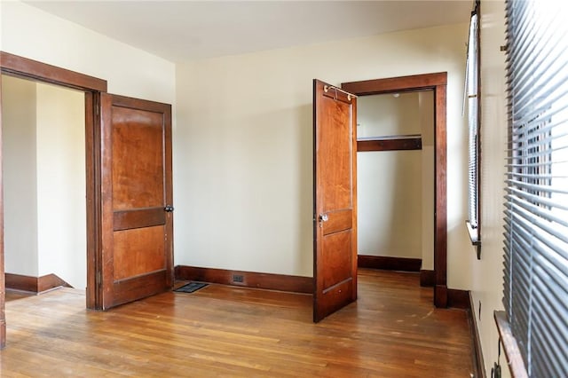 315 Wright St, Mckees Rocks, PA 15136 - unfurnished bedroom with wood-type flooring and baseboards