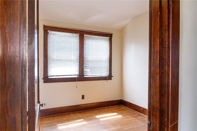 315 Wright St, Mckees Rocks, PA 15136 - spare room with wood finished floors, baseboards, and vaulted ceiling