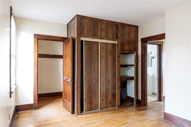 315 Wright St, Mckees Rocks, PA 15136 - unfurnished bedroom featuring light wood-style floors, baseboards, and a closet