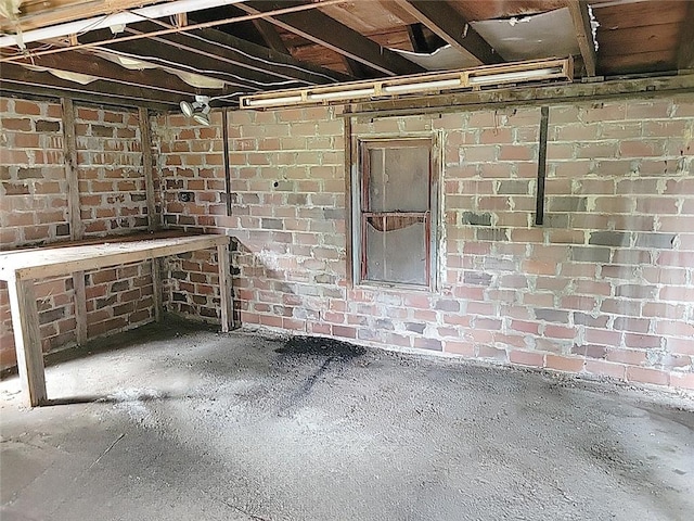 214 Washington Ave, Mount Pleasant Twp Was, PA 15340 - unfinished basement featuring brick wall