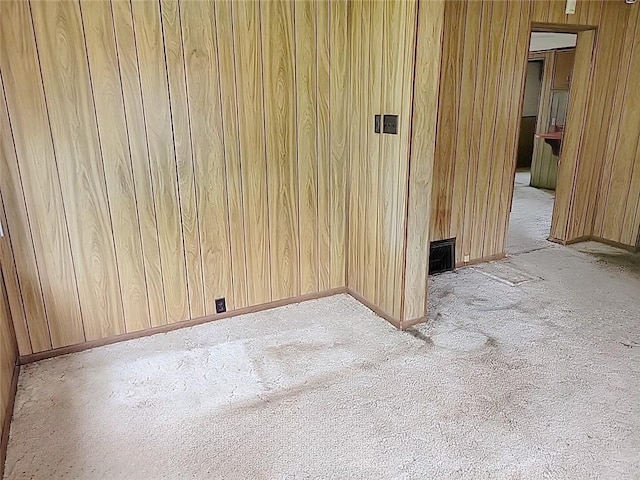 214 Washington Ave, Mount Pleasant Twp Was, PA 15340 - empty room featuring wood walls, light carpet, and baseboards