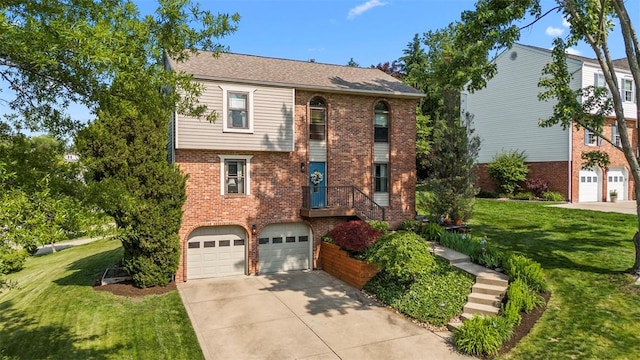208 Ruffed Grouse Dr, North Fayette, PA 15126 - view of front facade with driveway, a garage, brick siding, and a front yard