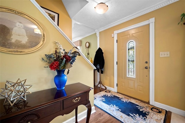 208 Ruffed Grouse Dr, North Fayette, PA 15126 - foyer entrance featuring baseboards, a textured ceiling, and wood finished floors