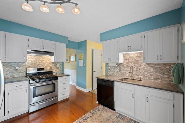 208 Ruffed Grouse Dr, North Fayette, PA 15126 - kitchen featuring gas range, black dishwasher, a sink, under cabinet range hood, and dark wood-type flooring