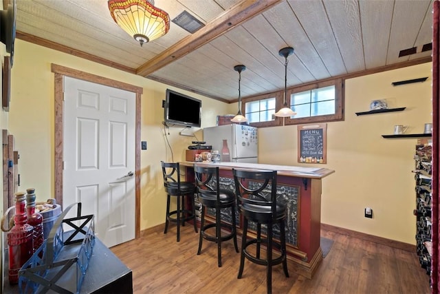 208 Ruffed Grouse Dr, North Fayette, PA 15126 - indoor dry bar with wood ceiling, baseboards, wood finished floors, freestanding refrigerator, and decorative light fixtures