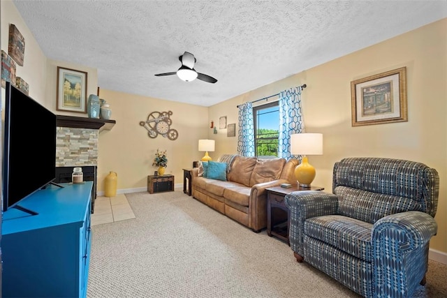 208 Ruffed Grouse Dr, North Fayette, PA 15126 - living room featuring carpet, a ceiling fan, a textured ceiling, a fireplace, and baseboards