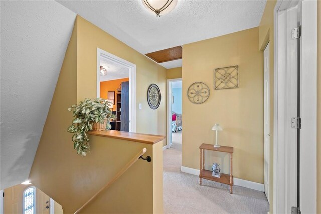 208 Ruffed Grouse Dr, North Fayette, PA 15126 - hallway with carpet floors, baseboards, and a textured ceiling