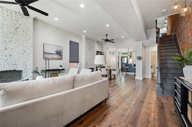 323 44th St, Lawrenceville, PA 15201 - living area featuring a ceiling fan, wood finished floors, recessed lighting, a fireplace, and stairs