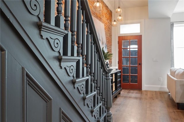 323 44th St, Lawrenceville, PA 15201 - foyer entrance with baseboards, light wood-style floors, stairs, and healthy amount of natural light