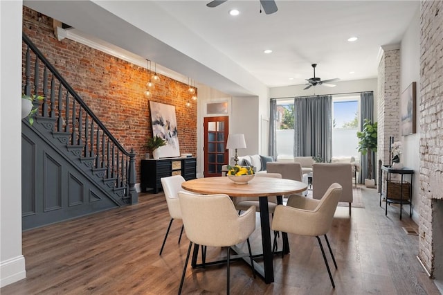 323 44th St, Lawrenceville, PA 15201 - dining space featuring ceiling fan, wood finished floors, stairway, brick wall, and recessed lighting