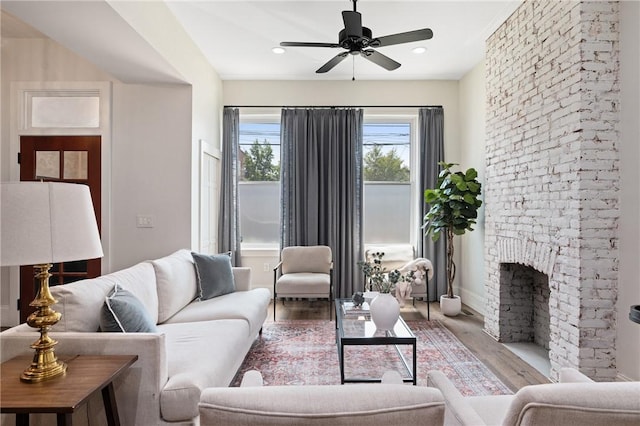323 44th St, Lawrenceville, PA 15201 - living room featuring wood finished floors, ceiling fan, baseboards, recessed lighting, and a fireplace
