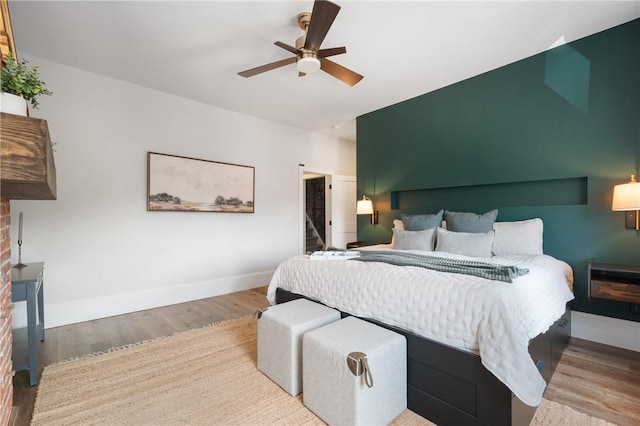 323 44th St, Lawrenceville, PA 15201 - bedroom featuring wood finished floors, baseboards, and a ceiling fan