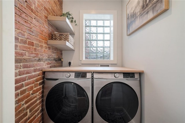 323 44th St, Lawrenceville, PA 15201 - washroom with washer and clothes dryer and brick wall