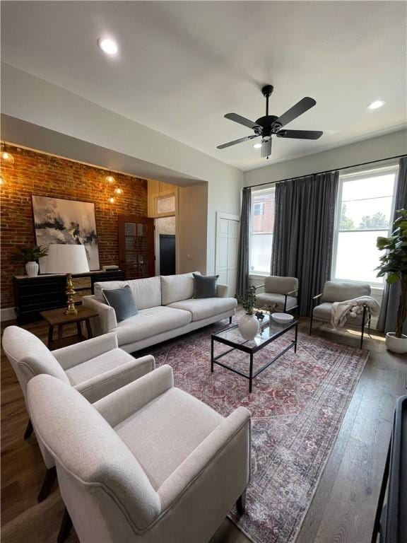 323 44th St, Lawrenceville, PA 15201 - living area featuring brick wall, wood finished floors, a ceiling fan, and recessed lighting