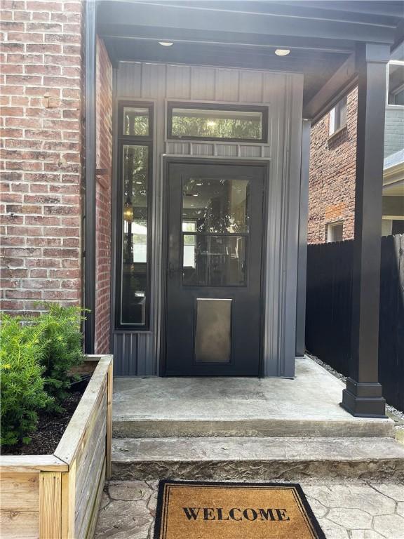 323 44th St, Lawrenceville, PA 15201 - property entrance with brick siding
