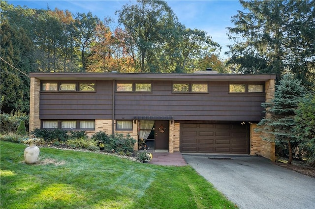 102 Colwyn Rd, Ross Twp, PA 15237 - view of front of property with driveway, brick siding, a garage, and a front lawn