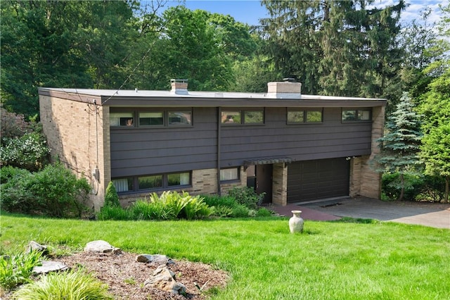 102 Colwyn Rd, Ross Twp, PA 15237 - view of front of home featuring brick siding, concrete driveway, a chimney, a front lawn, and an attached garage