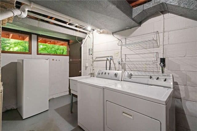 102 Colwyn Rd, Ross Twp, PA 15237 - laundry area with washer and clothes dryer and concrete block wall