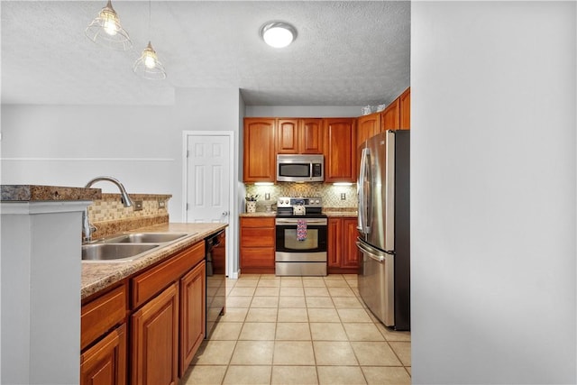 254 Maple Ridge Dr, Cecil, PA 15317 - kitchen featuring stainless steel appliances, a sink, backsplash, a textured ceiling, and light countertops
