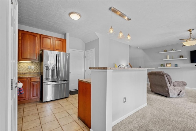 254 Maple Ridge Dr, Cecil, PA 15317 - kitchen with stainless steel fridge with ice dispenser, hanging light fixtures, tasteful backsplash, brown cabinetry, and a ceiling fan
