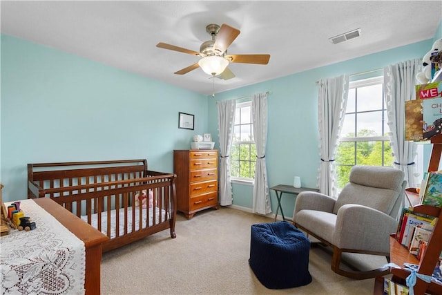 254 Maple Ridge Dr, Cecil, PA 15317 - bedroom with a crib, light carpet, ceiling fan, and baseboards