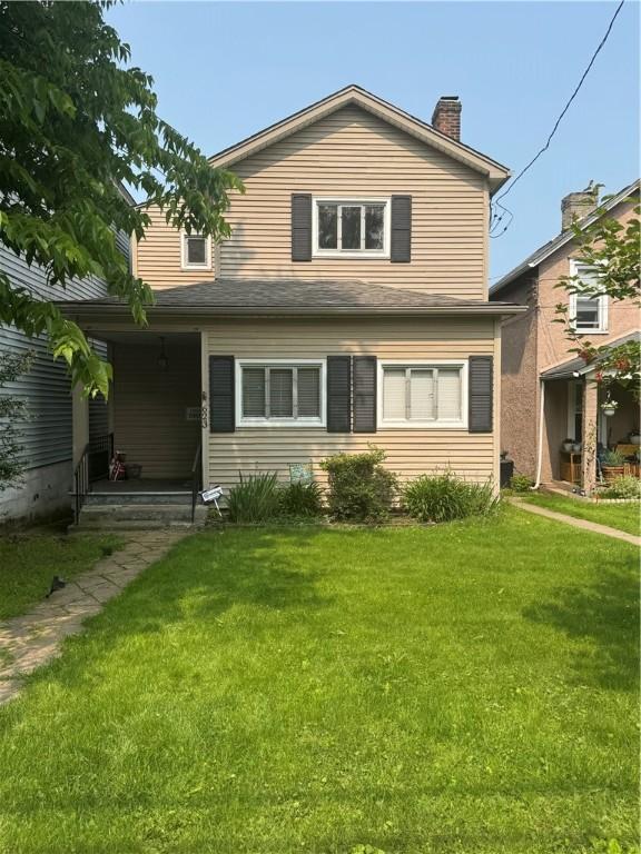 623 5th St, Oakmont, PA 15139 - traditional-style home featuring a front yard, a chimney, and a porch