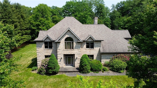 203 Blackthorn Dr, Penn Twp But, PA 16002 - view of front of home featuring a front lawn, a chimney, and a shingled roof