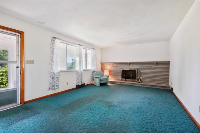 109 Mattier Dr, Ohara, PA 15238 - unfurnished living room featuring a stone fireplace, carpet floors, and baseboards