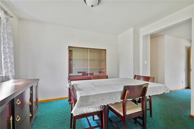109 Mattier Dr, Ohara, PA 15238 - dining area featuring dark colored carpet and baseboards