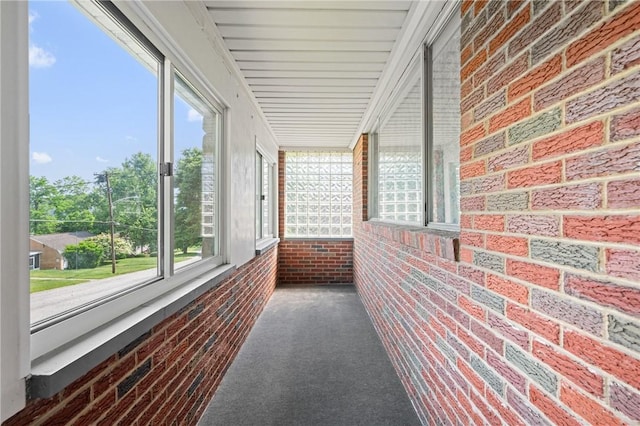 109 Mattier Dr, Ohara, PA 15238 - unfurnished sunroom featuring brick wall and carpet floors