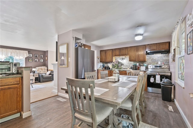 1006 Willow Glen Dr, Bethel Park, PA 15102 - dining space with wood finished floors and baseboards