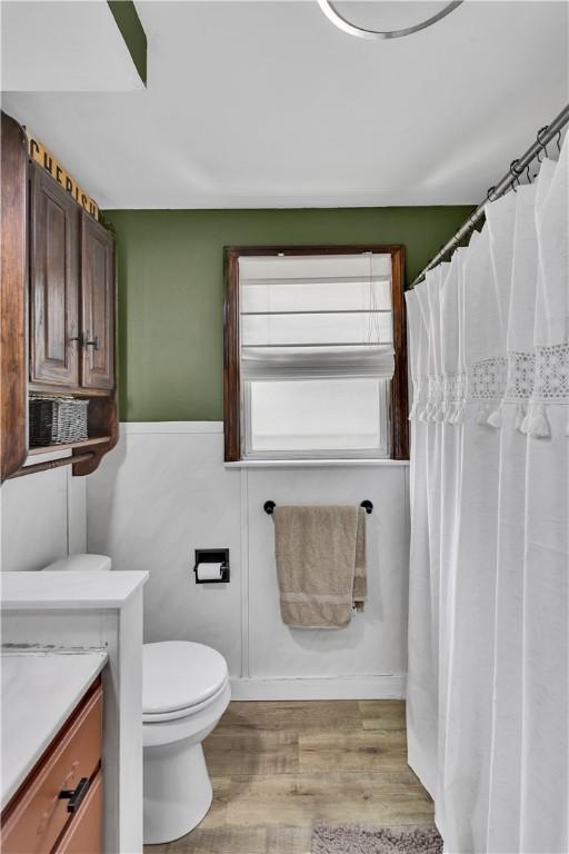169 Plum Way, Wayne Twp Law, PA 16157 - full bath with toilet, wood finished floors, vanity, and a wainscoted wall