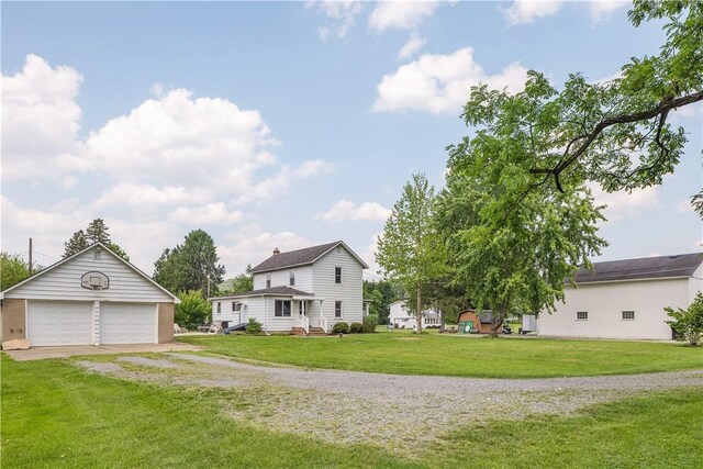 169 Plum Way, Wayne Twp Law, PA 16157 - view of front of property featuring a detached garage, an outdoor structure, and a front lawn