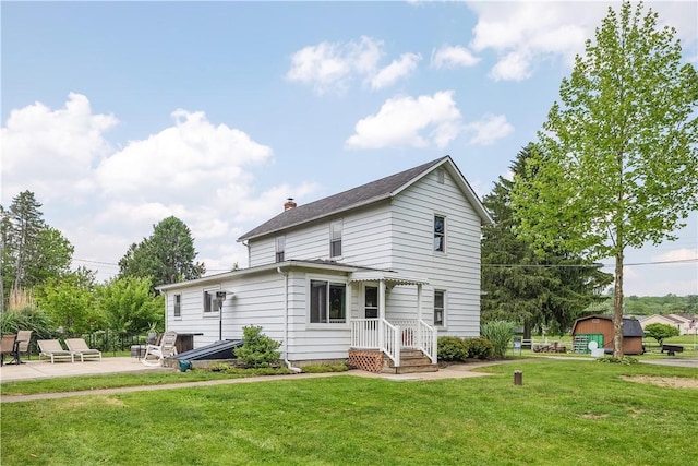 169 Plum Way, Wayne Twp Law, PA 16157 - view of front of home with a patio, a chimney, and a front yard