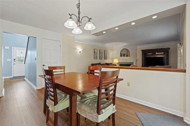113 Silo Ct, North Fayette, PA 15071 - dining room with a fireplace, wood finished floors, recessed lighting, a chandelier, and baseboards