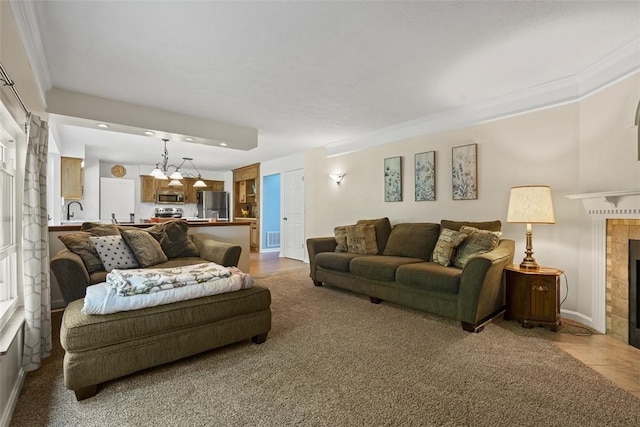 113 Silo Ct, North Fayette, PA 15071 - living room featuring baseboards, a fireplace, recessed lighting, crown molding, and a chandelier