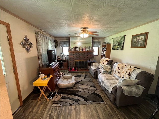 807 Sutton St, Punxsutawney Area School District, PA 15767 - living area featuring wood finished floors, a brick fireplace, a ceiling fan, and an ornate ceiling