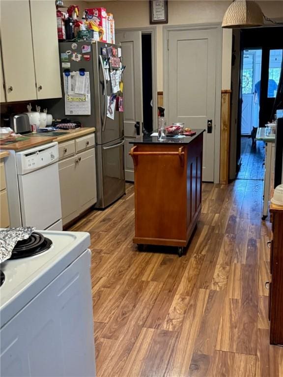 111 Central Ave, Chicora Boro, PA 16025 - kitchen with white dishwasher, white cabinets, light wood-style flooring, and stove