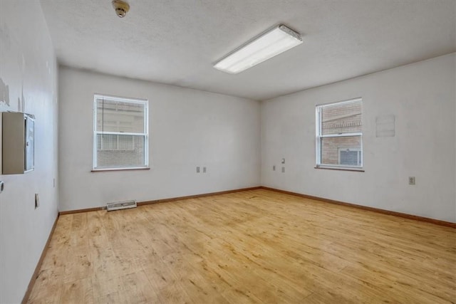 1632 Lincoln Way, White Oak, PA 15131 - unfurnished room featuring wood finished floors, baseboards, and a smoke detector