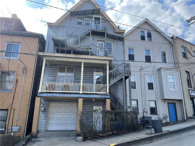 3884 E St, Perry Hilltop, PA 15214 - view of front of house featuring a garage and a balcony