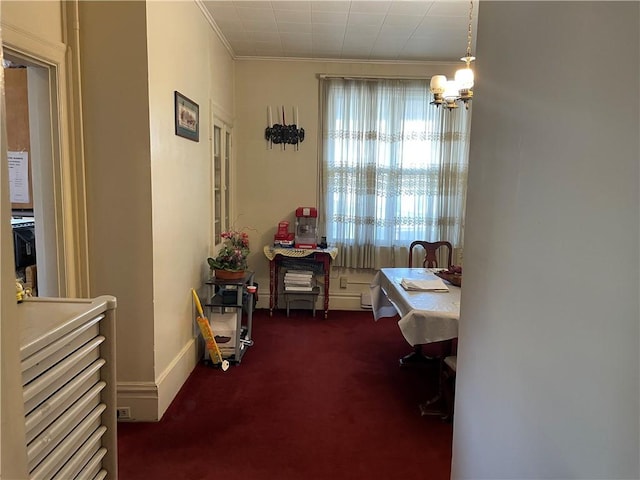 3884 E St, Perry Hilltop, PA 15214 - dining room featuring dark carpet, ornamental molding, and a chandelier
