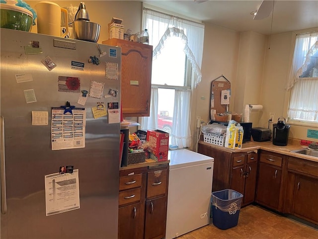 3884 E St, Perry Hilltop, PA 15214 - kitchen featuring freestanding refrigerator, fridge, light countertops, and a sink