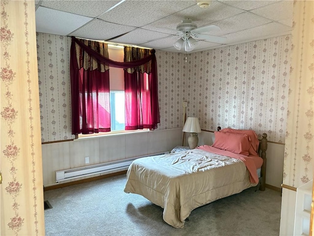 3884 E St, Perry Hilltop, PA 15214 - bedroom with wallpapered walls, carpet floors, a drop ceiling, a baseboard radiator, and ceiling fan
