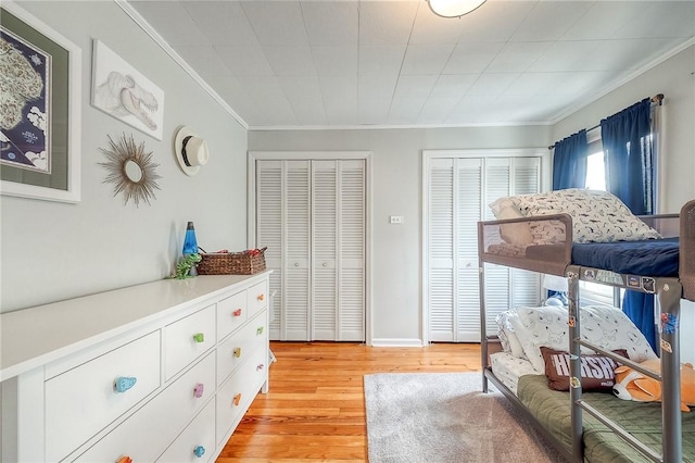 429 Market St, Beaver, PA 15009 - bedroom with crown molding, light wood-style floors, and multiple closets