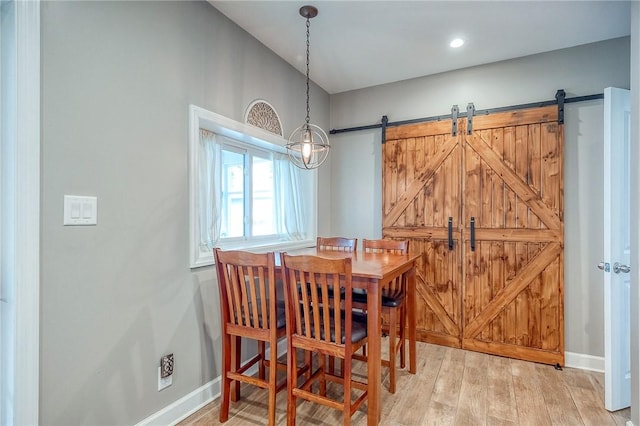 429 Market St, Beaver, PA 15009 - dining area with a barn door, baseboards, and light wood-type flooring
