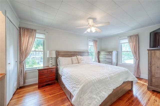 429 Market St, Beaver, PA 15009 - bedroom with multiple windows, light wood-style flooring, ornamental molding, baseboards, and ceiling fan