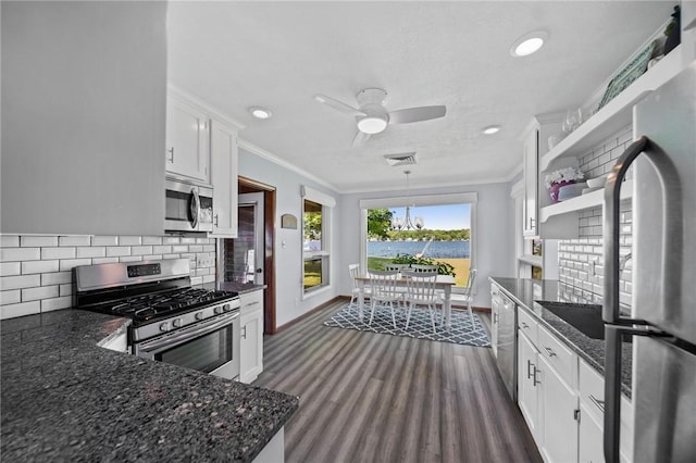 10756 Aldina Dr, Conneaut Lake, PA 16316 - kitchen featuring stainless steel appliances, a water view, crown molding, baseboards, and open shelves